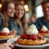 Gelukkige mensen genieten van wafels in een gezellig Belgisch café