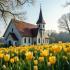 Rustige kerk met bloemen in het voorjaar